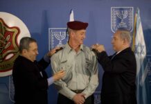 Israeli Prime Minister Benjamin Netanyahu, right, and Defense Minister Ehud Barak, left, take part in a ceremony formally promoting Maj. Gen. Benny Gantz, center, to lieutenant general and making him the 20th chief of the general staff of the Israel Defense Forces Feb. 14, 2011, at the prime minister's office in Jerusalem. U.S. Chairman of the Joint Chiefs of Staff Navy Adm. Mike Mullen was among the guests in attendance. (U.S. Army photo by Staff Sgt. Teddy Wade/Released)
