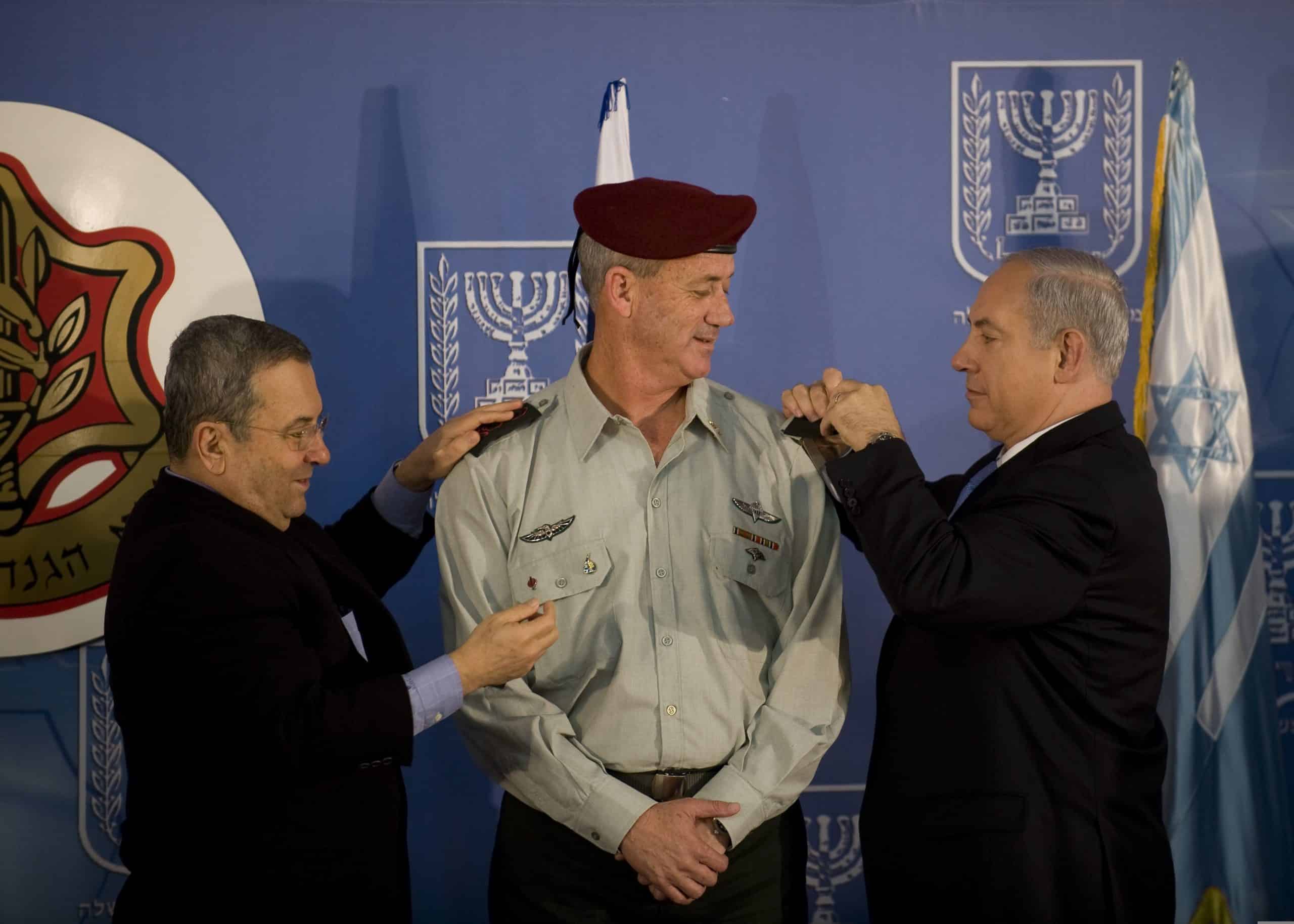 Israeli Prime Minister Benjamin Netanyahu, right, and Defense Minister Ehud Barak, left, take part in a ceremony formally promoting Maj. Gen. Benny Gantz, center, to lieutenant general and making him the 20th chief of the general staff of the Israel Defense Forces Feb. 14, 2011, at the prime minister's office in Jerusalem. U.S. Chairman of the Joint Chiefs of Staff Navy Adm. Mike Mullen was among the guests in attendance. (U.S. Army photo by Staff Sgt. Teddy Wade/Released)