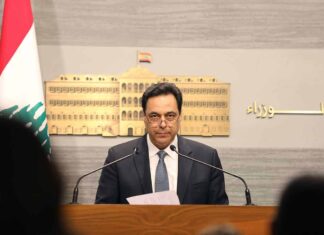 Triste centenaire du Grand Liban en défaut de paiement Le Premier Ministre libanais Hassan Diab, annonçant la mise en état de défaut du Liban. Crédit Photo: Dalati & Nohra, 8 mars 2020