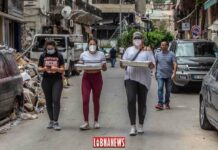 Des volontaires distribuant de la nourriture dans les quartiers de Mar Mikhael et de Gemmayzeh. Crédit Photo: François el Bacha pour Libnanews.com