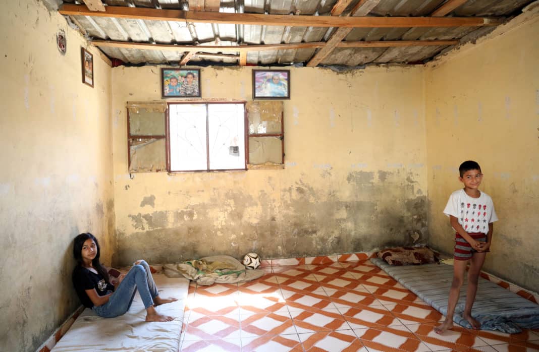 LEB_UNICEF's Work in Lebanon_ Photo 7 Sara and Bilal at their home in Hay el Gharbeh, an informal settlement in Southern Beirut. Their father, Tarek, cannot afford the basics for his four children: “Everything, from food to medicine, is difficult to buy this year. We have to live without basics”, he says.