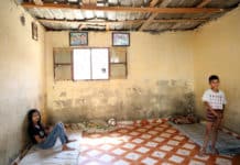 Sara and Bilal at their home in Hay el Gharbeh, an informal settlement in Southern Beirut. Their father, Tarek, cannot afford the basics for his four children: “Everything, from food to medicine, is difficult to buy this year. We have to live without basics”, he says.