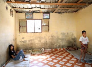 Sara and Bilal at their home in Hay el Gharbeh, an informal settlement in Southern Beirut. Their father, Tarek, cannot afford the basics for his four children: “Everything, from food to medicine, is difficult to buy this year. We have to live without basics”, he says.