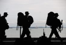 silhouette of soldiers walking