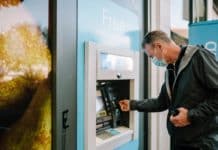 man using atm machine