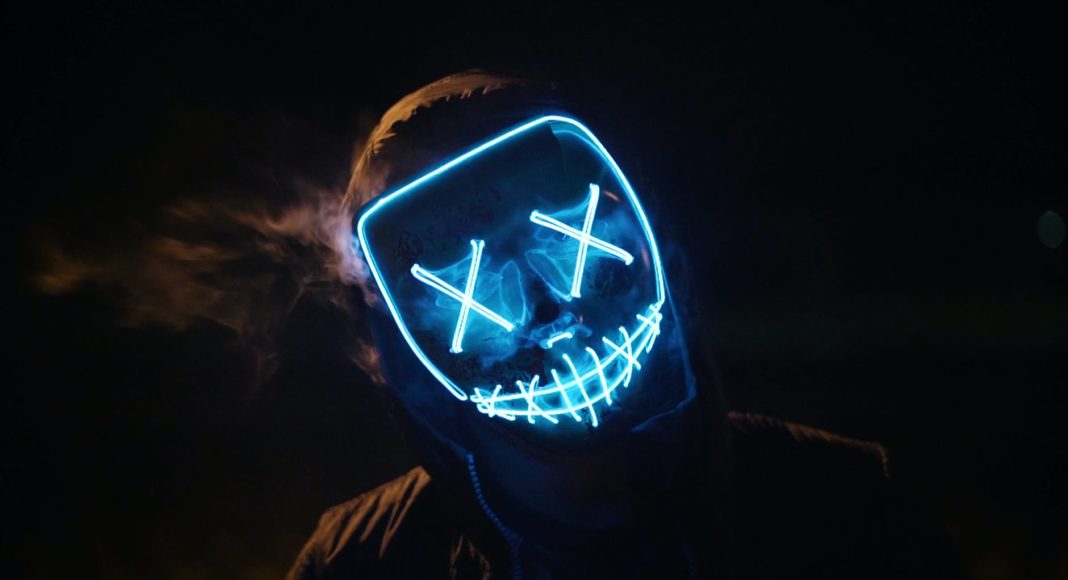 man wearing black and blue mask costume