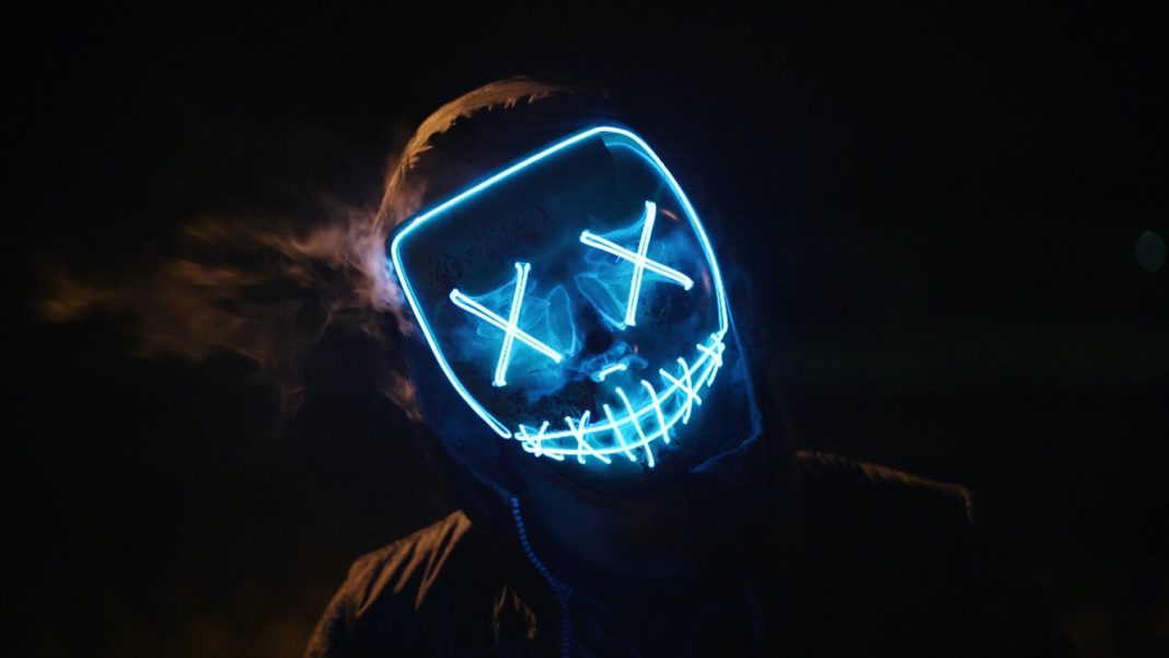 man wearing black and blue mask costume
