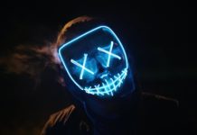 man wearing black and blue mask costume