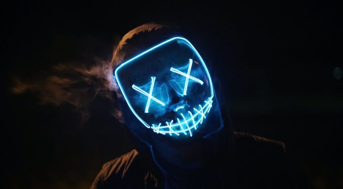 man wearing black and blue mask costume