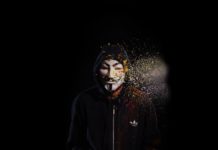 person wearing black hoodie and mask