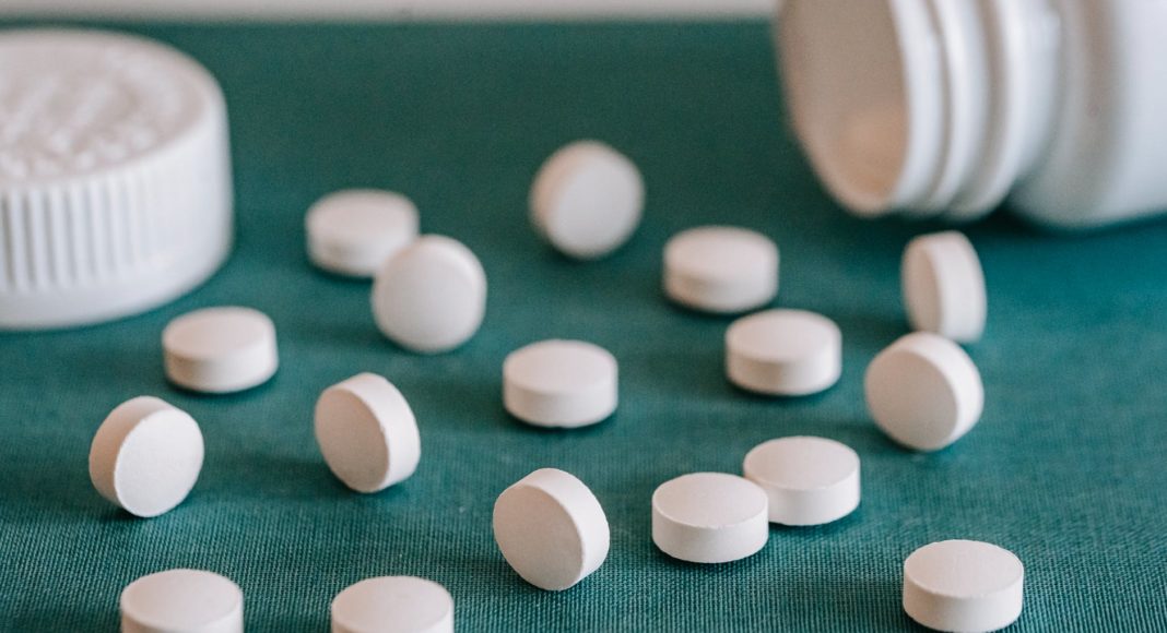 white pills spilled on table