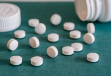 white pills spilled on table