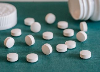 white pills spilled on table