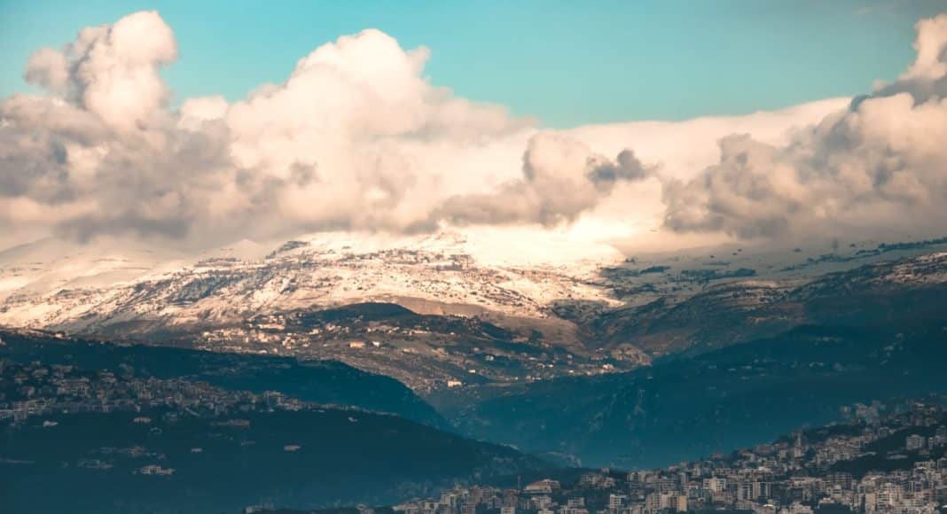 aerial view of mountains surrounding city