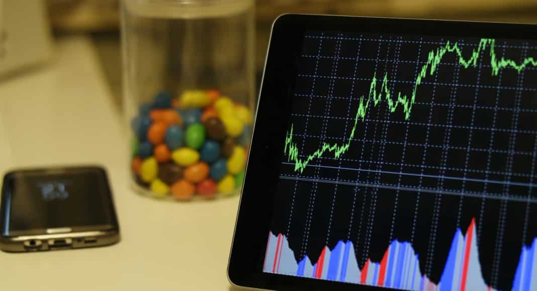 white android tablet turned on displaying a graph