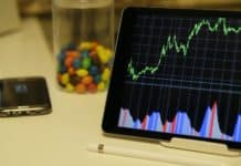 white android tablet turned on displaying a graph