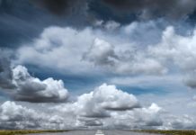 gray rolled asphalt road under cloudy sky