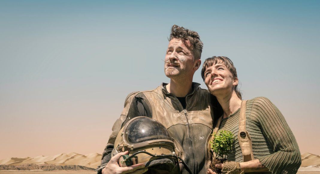 photo of man and woman looking at the sky