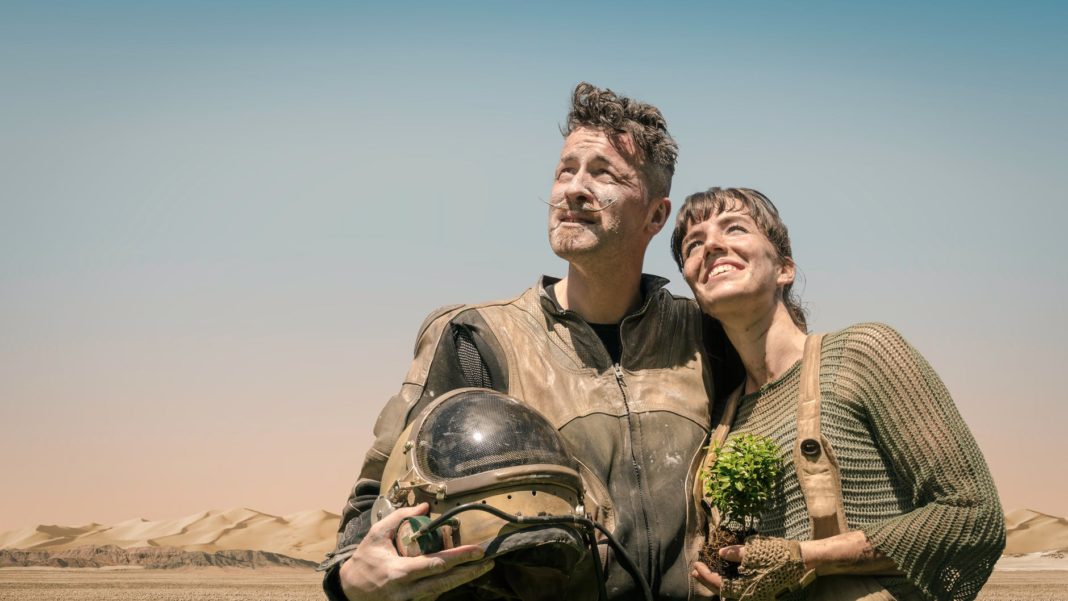 photo of man and woman looking at the sky