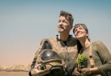 photo of man and woman looking at the sky