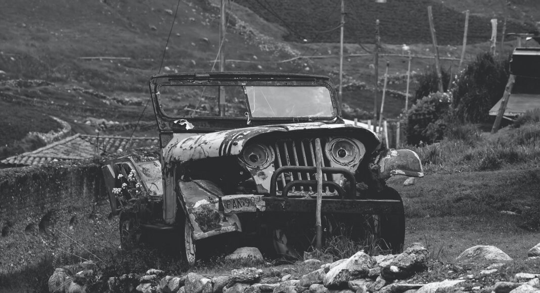 black and white road people dust