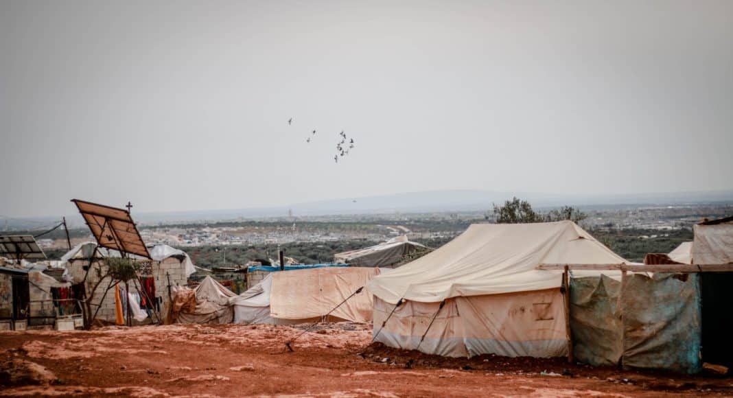tents and makeshift houses in the desert area