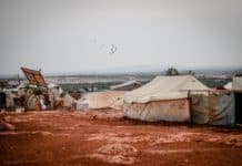 tents and makeshift houses in the desert area
