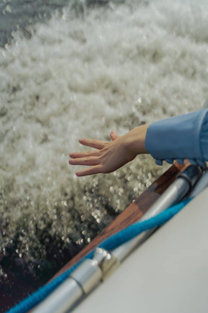 person s hand holding water