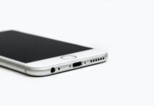 close up of mobile phone against white background