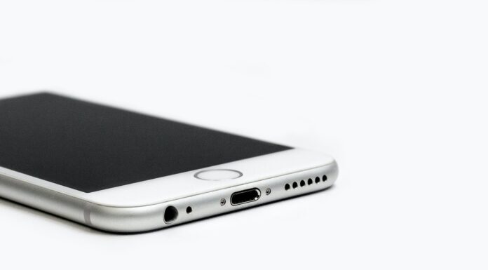 close up of mobile phone against white background