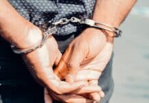 close up photography of person in handcuffs