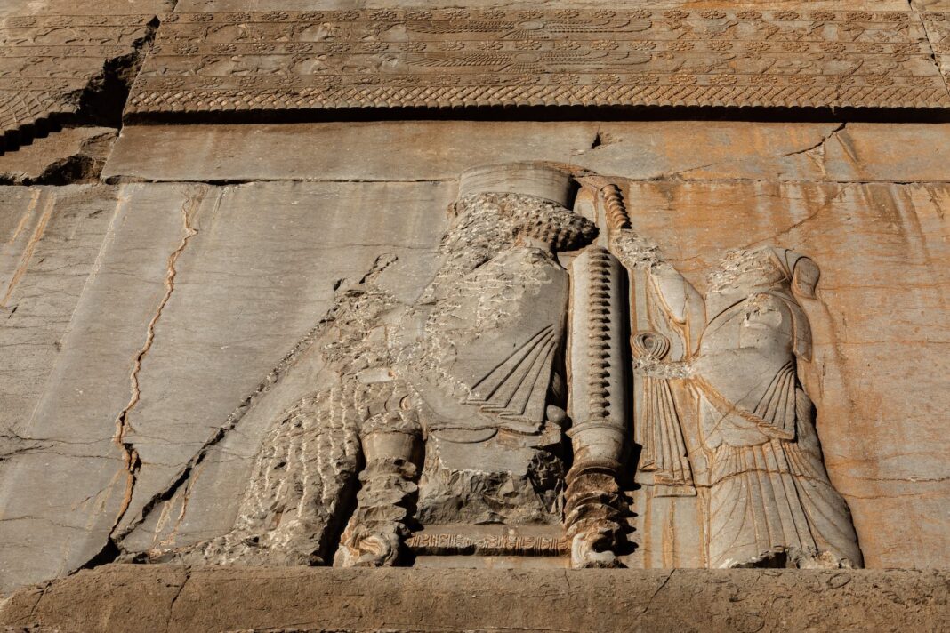 a ruined wall of the gate of all nations in persepolis iran