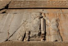 a ruined wall of the gate of all nations in persepolis iran