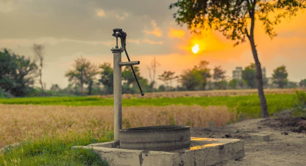 vintage water pump on a farmland