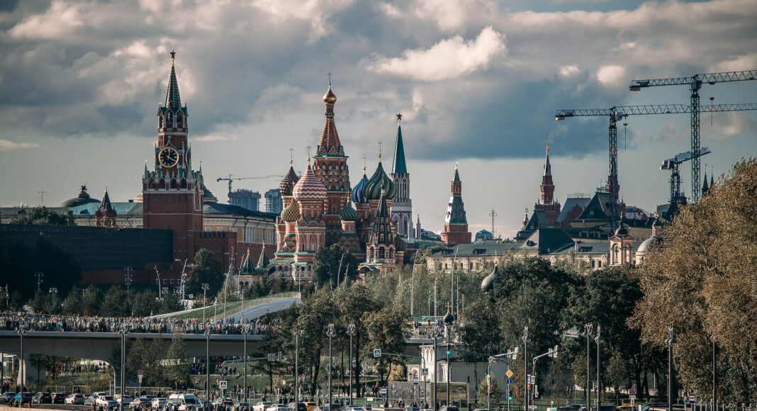 people walking on street near brown concrete building