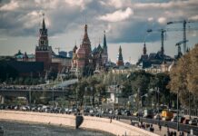 people walking on street near brown concrete building