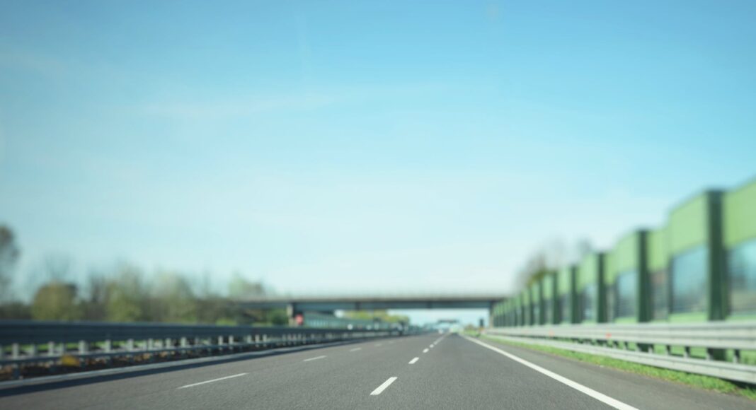 gray asphalt road under blue sky