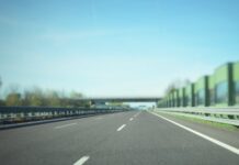 gray asphalt road under blue sky