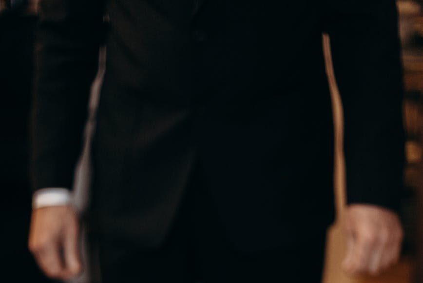 man standing next to the flag of israel