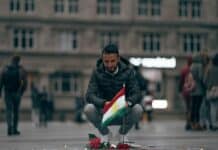 man on city square near memorial