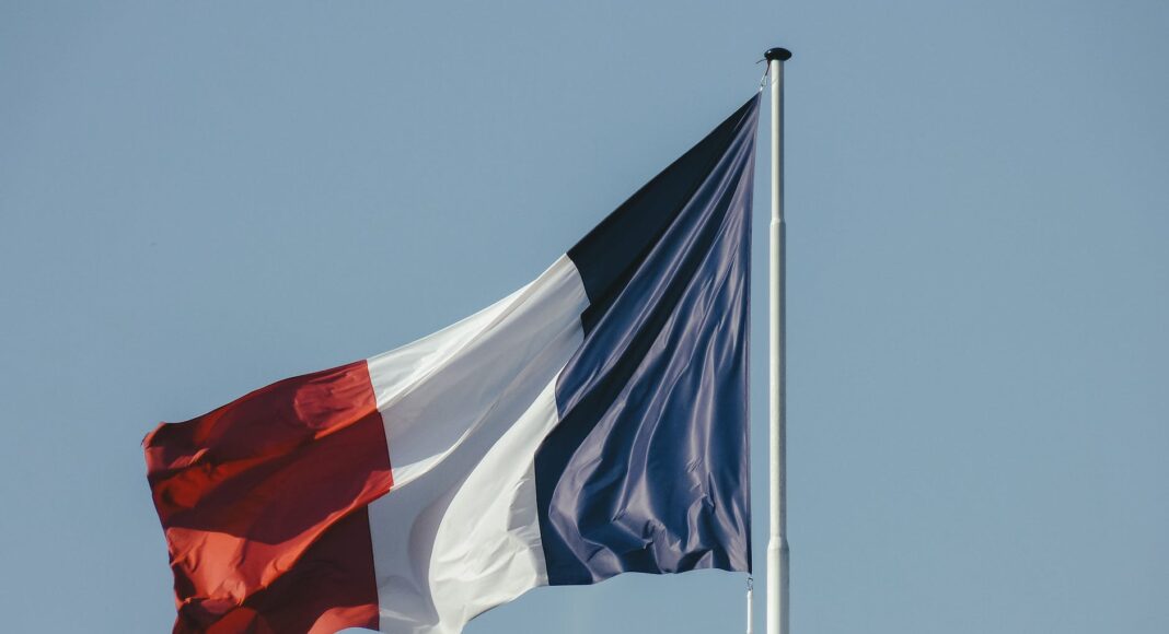 french flag against blue sky