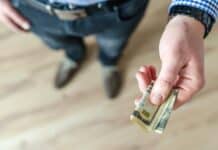 person holding banknote