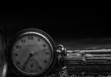 grayscale photography of silver watch