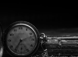 grayscale photography of silver watch