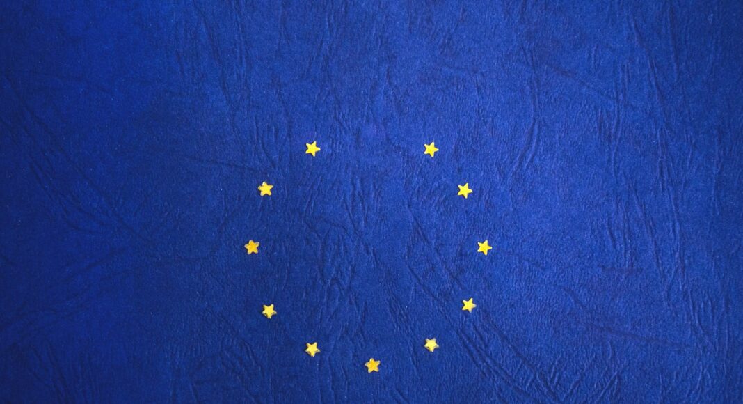 blue and yellow round star print textile