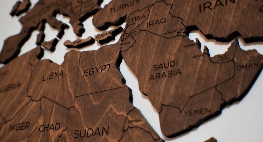 wooden puzzle pieces of a world map