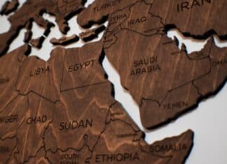 wooden puzzle pieces of a world map