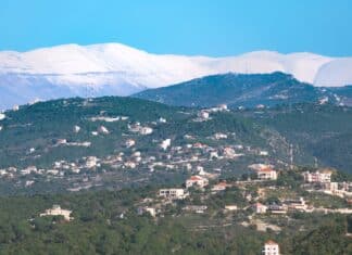 aerial photography of a village near mountains