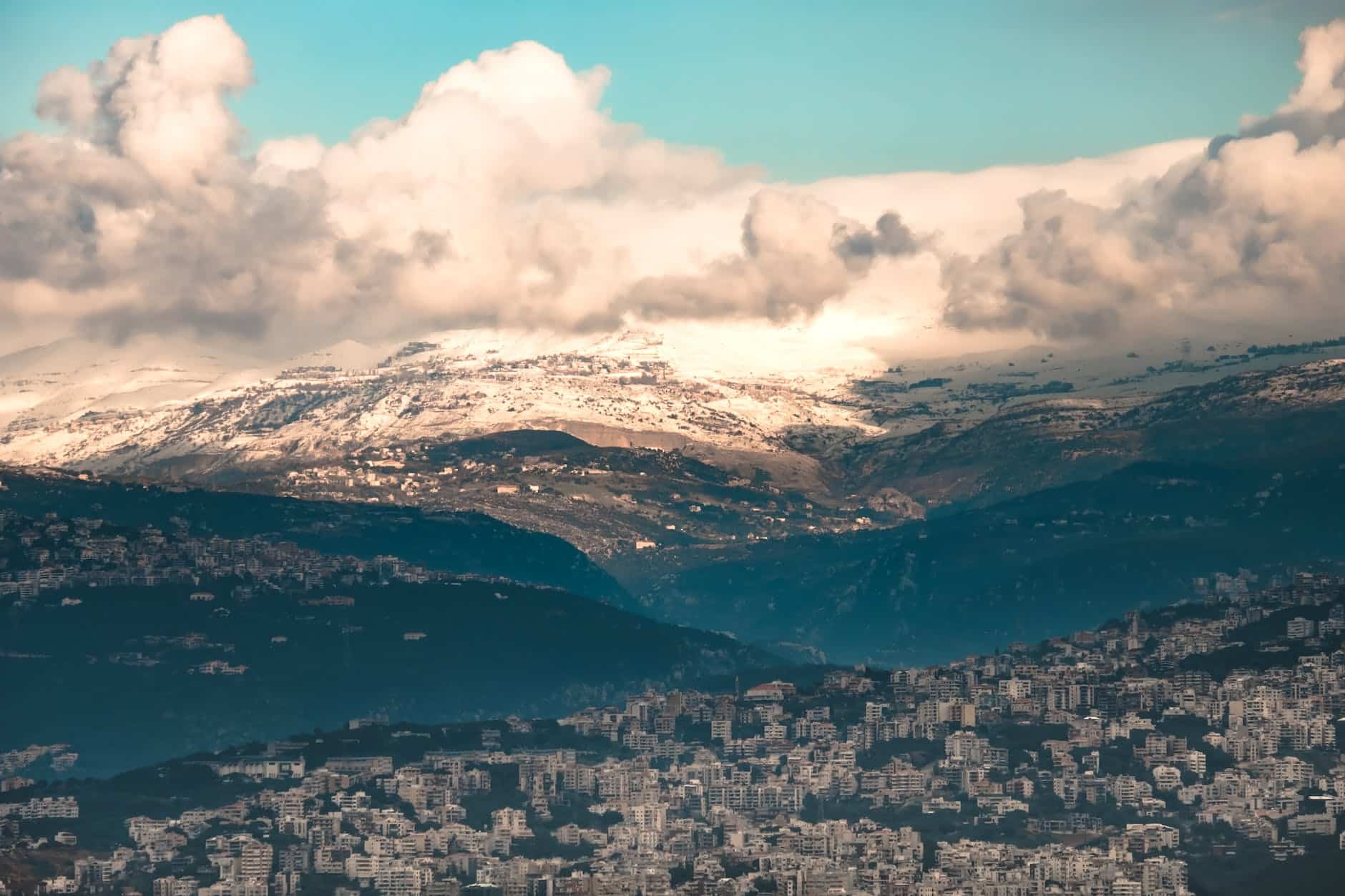 aerial view of mountains surrounding city