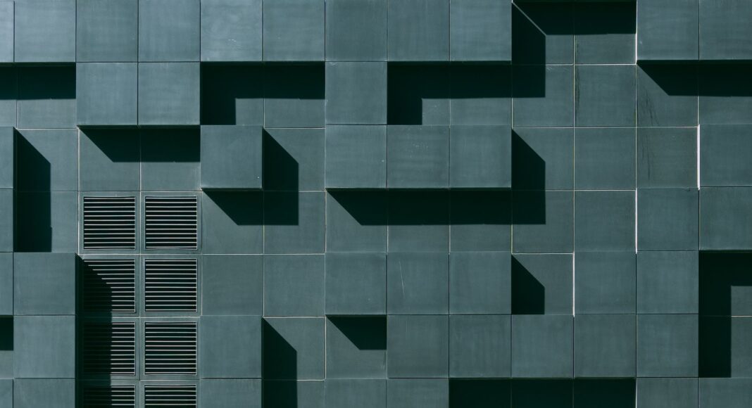gray concrete building exterior with geometric design
